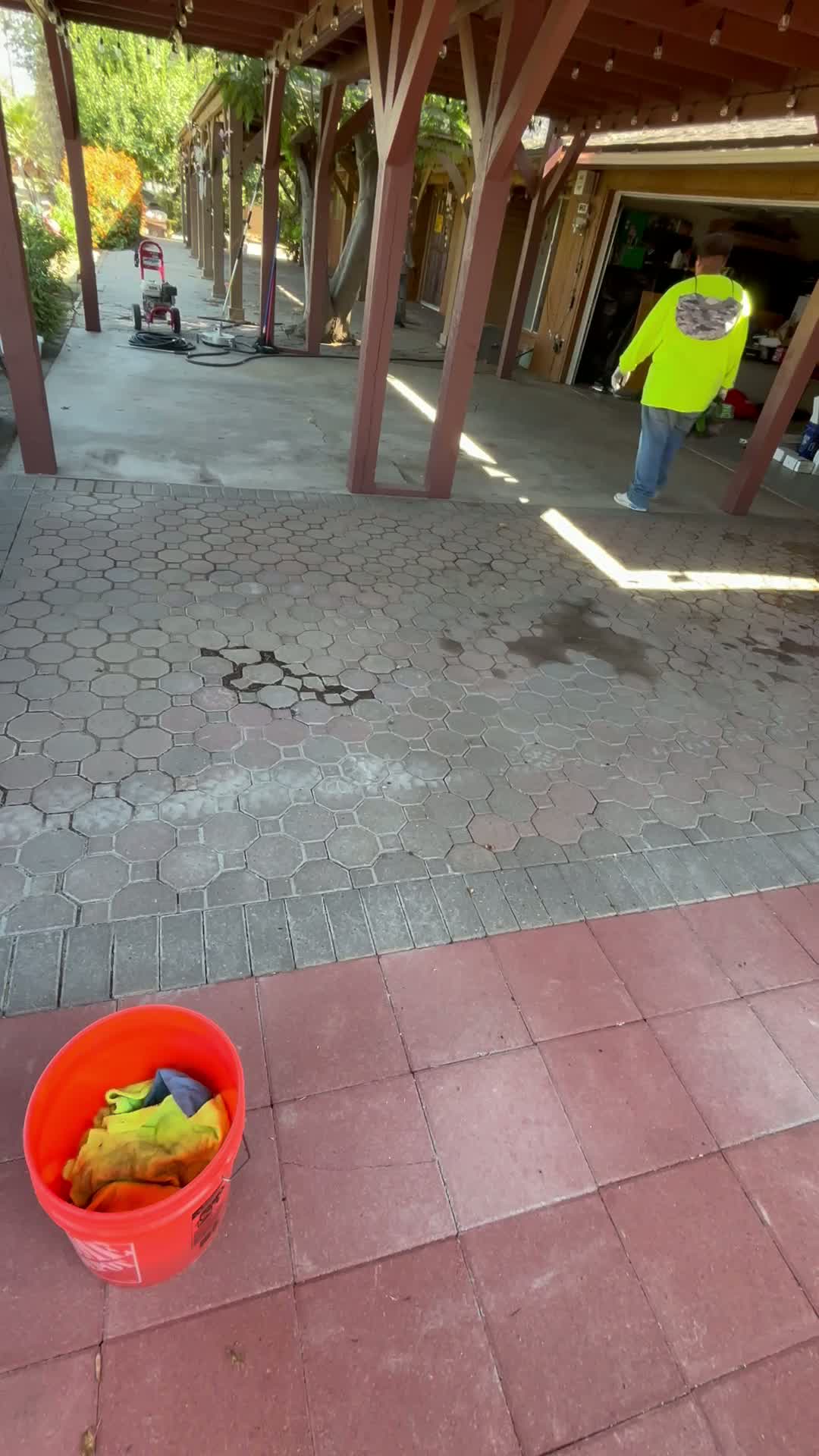 Finished concrete and paver patio area after Valley Concrete pressure washing, with clean surfaces and job equipment on site.