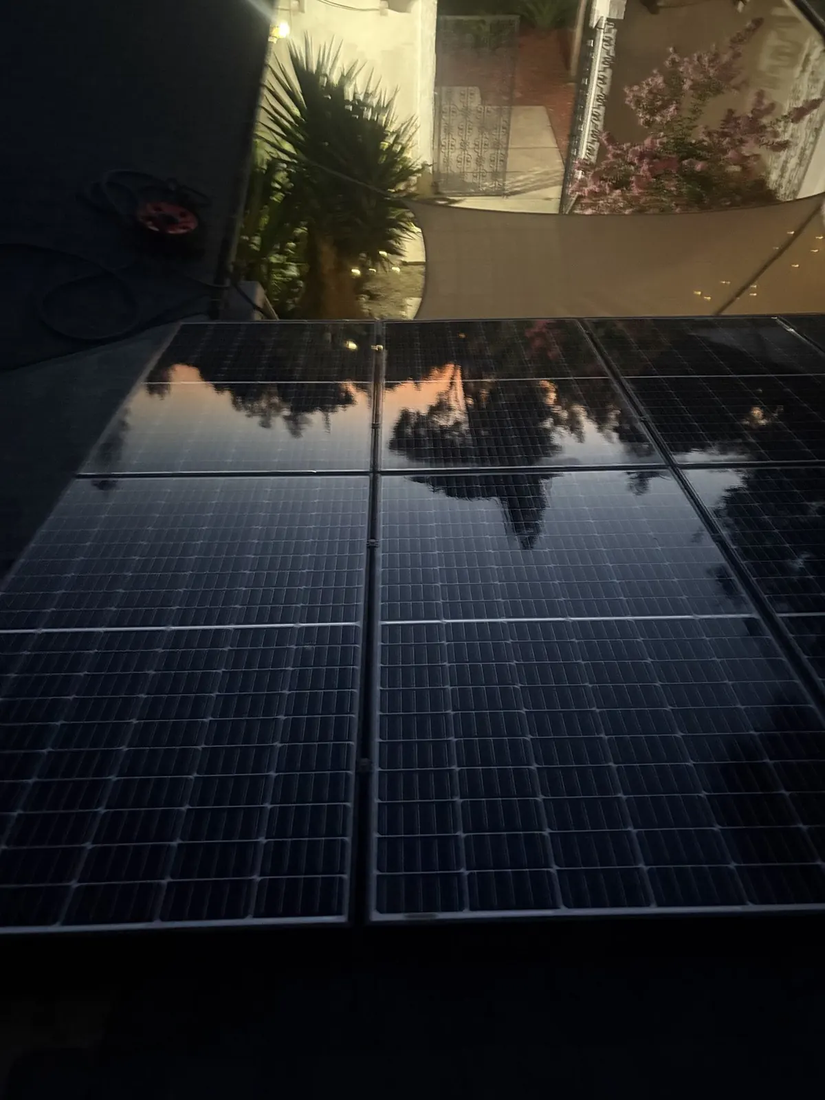 Macro close-up of a spotless solar panel with a mirror-clean reflective surface after cleaning.